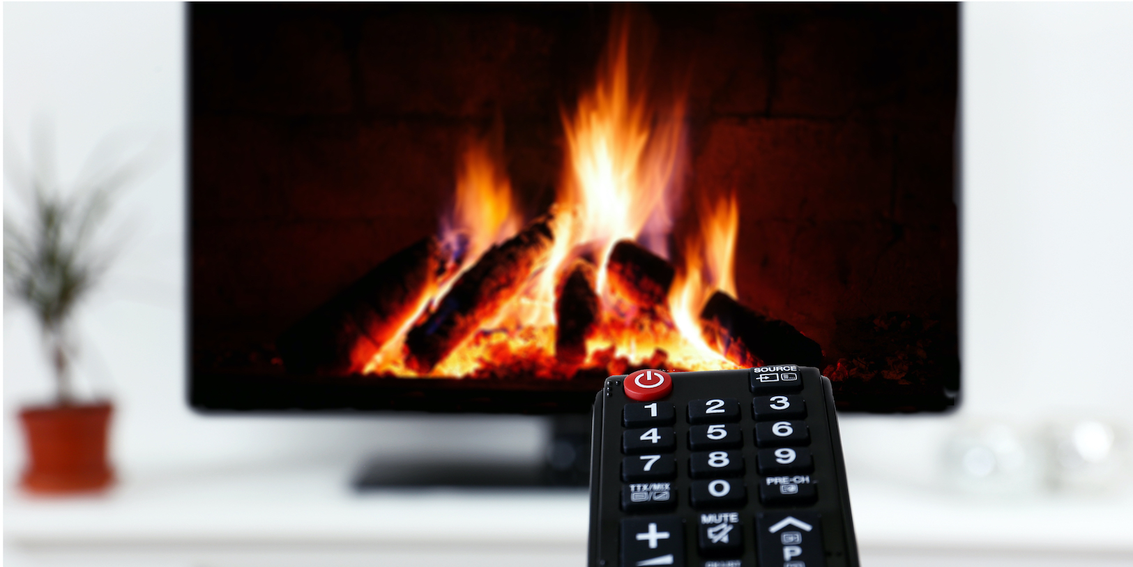 Fireplace video on a TV with a remote pointed at it